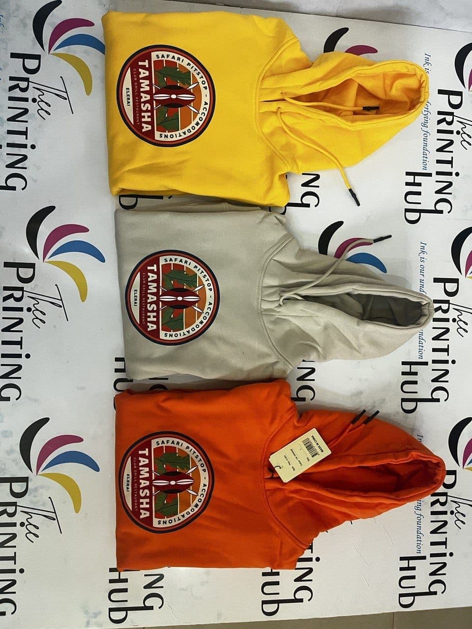 Embroidered hoodies in yellow, grey and orange