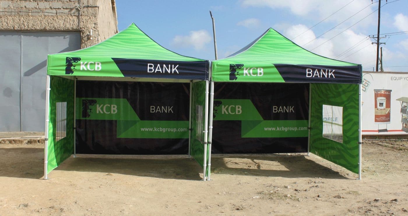 Two green branded event tents